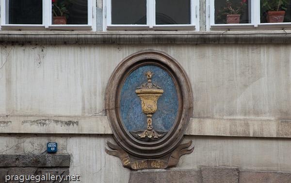 Detail of the Golden Cup house sign at N. 16 of Nerudova